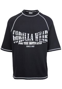 Zwarte t-shirt met korte mouwen en een gestructureerde stof. Voorzien van grijze stiksels en een witte grafische print met "GORILLA WAR" en "FOR THE MOTIVATED."