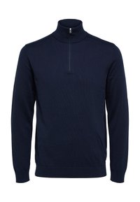 Marinblå, långärmad tröja med halvdragkedja i kragen. Har ribbade ärmslut och fåll, tillverkad av ett slätt, strukturerat tyg.