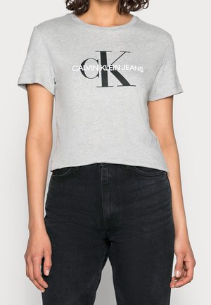 Šedé bavlněné tričko s krátkými rukávy, na hrudi velké černé logo "CK" a bílý nápis "CALVIN KLEIN JEANS".