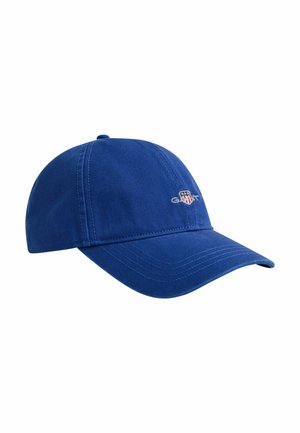 Blauwe baseballpet met gebogen klep en klein logo met een schild en het woord "GANT" op het voorpaneel.