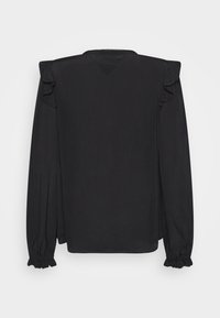 Blusa nera con maniche lunghe e dettagli arricciati, scollatura a V e una texture liscia. Il design sul retro è semplice e privo di decorazioni.