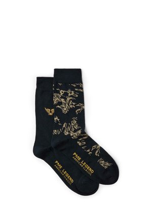 Paire de chaussettes noires avec motif tigre doré et logo PME Legend American Classic imprimé près des orteils et sur les bordures.