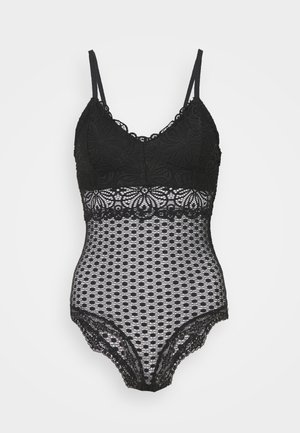 Must last bodysuit V-kaelusega ja reguleeritavate rihmadega. Omab keerukaid lillemotiive ja tekstuurset avatud kudumiga alumist osa.
