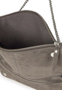 Gray suede handbag with a zipper closure, chain strap, and metal accents. Interior is lined, showcasing a simple design, no patterns.