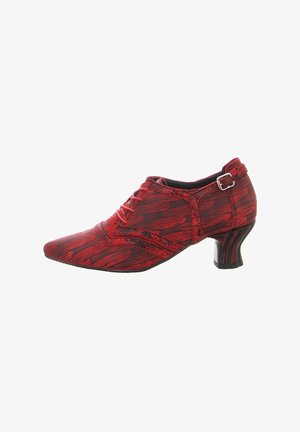 Red, patterned shoe with a pointed toe and lace-up design. Features a textured surface and a curved, black low heel. Buckle accent on side.