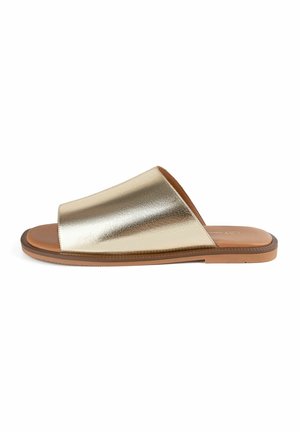 Arany szlájdról van szó, széles fényes pánttal és barna gumitalppal. Simább felülettel és nyitott orrú kialakítással rendelkezik.