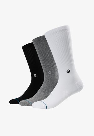 Cotton blend socks set in black, gray, and white. Ribbed texture with contrast accent colors at the toe; logo on each sock.