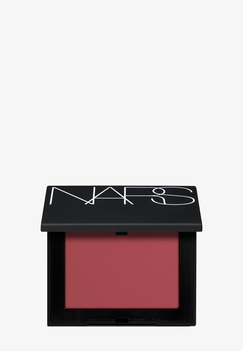 Boîtier compact noir ouvert avec logo NARS, présentant un blush poudre mat mauve-rose sur fond blanc uni.