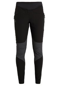 Černé sportovní kalhoty z elastického materiálu, s vysokým pasem a síťovými panely po stranách. Přední kapsy na zip.