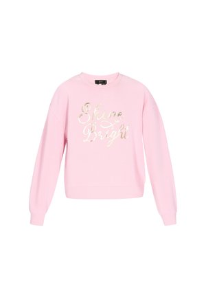 Sweatshirt rose avec des manches longues, un col rond et un ourlet légèrement court, présentant une inscription dorée métallique "Shine Bright" sur le devant.