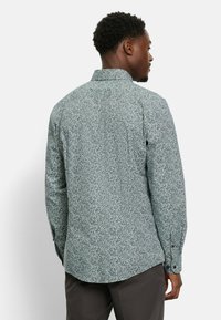 Heren overhemd met lange mouwen in een lichtgroen patroon met donkerblauwe slingers, met een button-down kraag en manchetten, van katoen, met een comfortabele pasvorm.