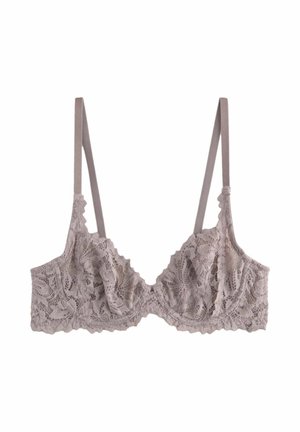 Kanten bh in zacht taupe met ingewikkelde bloempatronen, golfachtige randen en verstelbare bandjes. Heeft een lichte, delicate textuur.