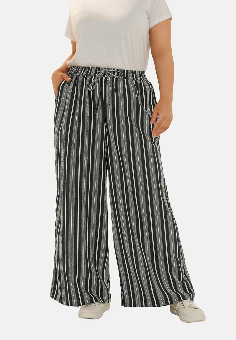 Randiga byxor med vida ben i svart och vitt, med dragsko i midjan, tillverkade av ett lättviktigt material, med två sidfickor.