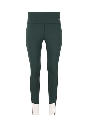Leggings de sport verts avec une taille haute. Présentent un accent blanc au niveau de la cheville, fabriqués en tissu extensible et doux.