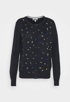 Cardigan noir boutonné avec des motifs de points abstraits colorés dispersés sur le devant et les manches longues.