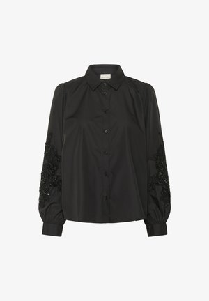 Chemise noire à boutons avec de longues manches bouffantes, ornée d'une broderie florale en perles complexe sur les poignets. Tissu en coton lisse, coupe ajustée.