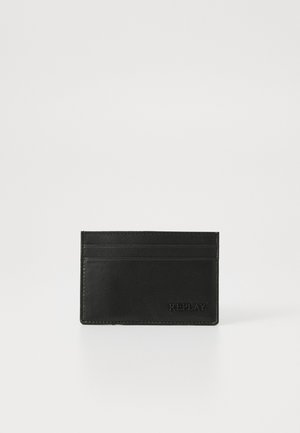 Black leather cardholder with textured surface, featuring four card slots and embossed "REPLAY" logo at the bottom. Simple rectangular design.