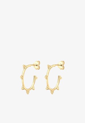 Boucles d'oreilles créoles en or avec plusieurs petits accents de perles agglomérées, espacés uniformément autour de chaque créole.