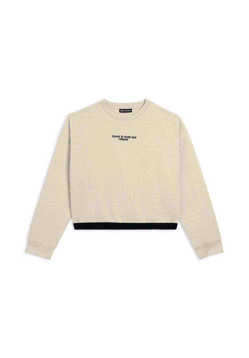 Sudadera corta beige de tela suave. Cuenta con mangas largas, cuello redondo y puño negro. El texto en el frente dice "HOY ES TU DÍA."