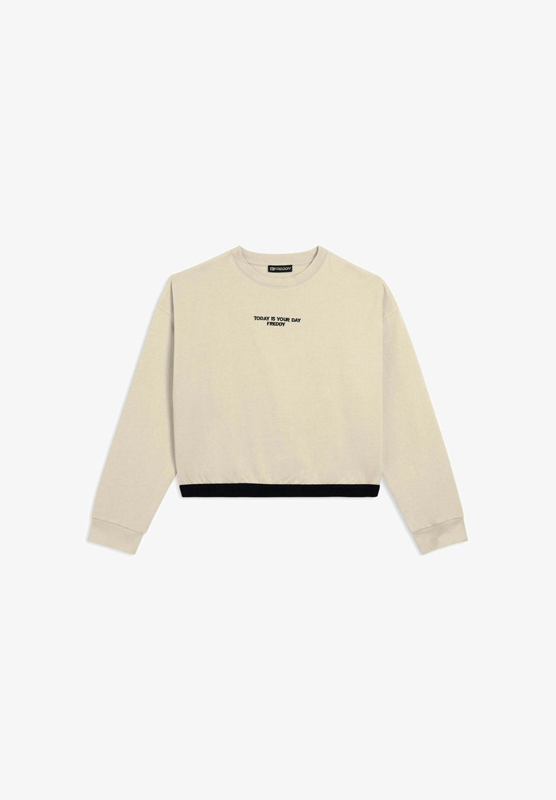 Sudadera corta beige de tela suave. Cuenta con mangas largas, cuello redondo y puño negro. El texto en el frente dice "HOY ES TU DÍA."