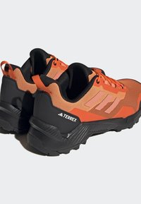 Adidas Terrex EASTRAIL 2 - Hiking shoes - impact orange/coral fusion/core black