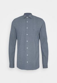 Camicia a maniche lunghe in blu navy con motivo a rilievo. Presenta chiusura frontale con bottoni, colletto appuntito e piccolo logo del marchio sul petto.