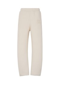 Beige Sweatpants mit einem elastischen Bund, der ein dezentes, eingeprägtes Logo an der Oberschenkeloberseite zeigt. Hergestellt aus weichem, strukturiertem Stoff.