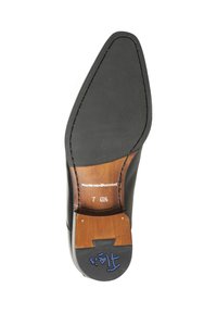 Sole di scarpa in pelle nera con punta affusolata. Presenta un sottopiede in gomma nera testurizzata, un tacco in legno e marchi del brand impressi.