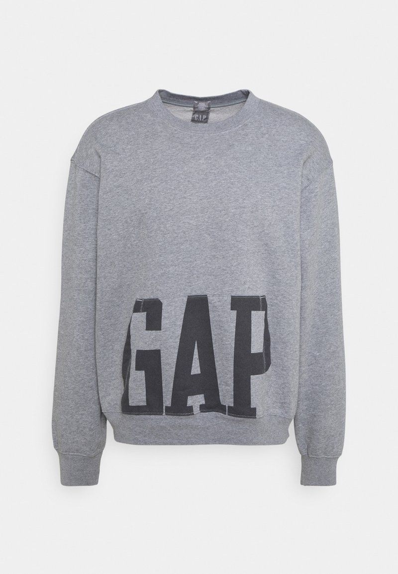 Sweat-shirt gris à col rond avec le logo GAP noir imprimé sur le bas à l'avant, manches longues, poignets et ourlet côtelés.