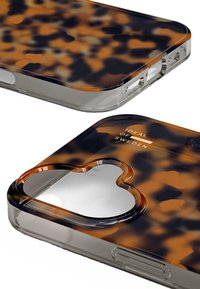 Tortoiseshell-patterned phone case featuring a transparent border, cutout for the camera, and “IDEAL OF SWEDEN” branding.