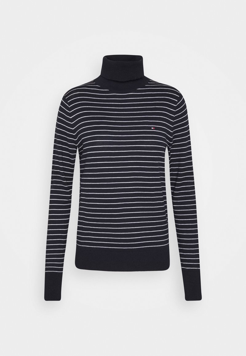 Pull col roulé bleu marine avec rayures horizontales blanches, poignets et ourlet côtelés. Petit logo sur le côté supérieur gauche de la poitrine. Tissu maille doux.