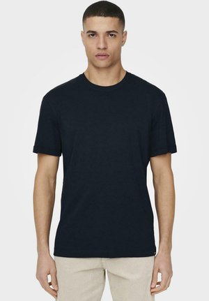 Navy blue cotton t-shirt with a round neckline, short sleeves, and a relaxed fit. Minimal design with no visible patterns or logos.