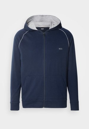 Navy zip-up hoodie with gray interior lining, features a drawstring hood, two front pockets, and contrasting white stitching. BOSS logo displayed.