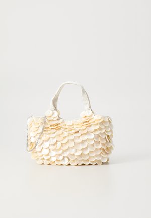 White handbag with textured, scalloped shell-like embellishments. Features a woven handle and a silver chain strap for versatility.