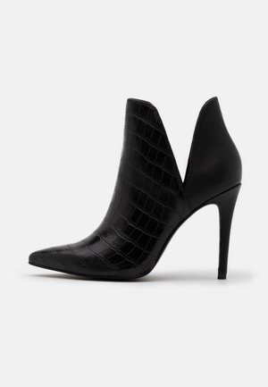 Bottines à talons hauts - black
