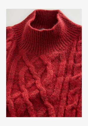 Red knitted sweater with a high, ribbed turtleneck and cable knit pattern. The fabric appears thick and textured, enhancing warmth.