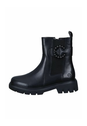 Bottines noires en cuir avec un panneau élastique sur le côté, un accent décoratif en métal en forme de cercle et une semelle en caoutchouc épaisse.