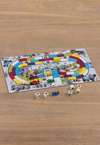 Board game featuring a colorful racetrack design with wooden car pieces in red, green, yellow, and blue, alongside multi-colored dice.