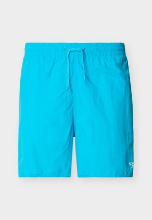 Svetlo modre kopalne hlače z elastičnim pasom in vrvico, z majhno belo logotipom Speedo na spodnjem desnem delu noge.