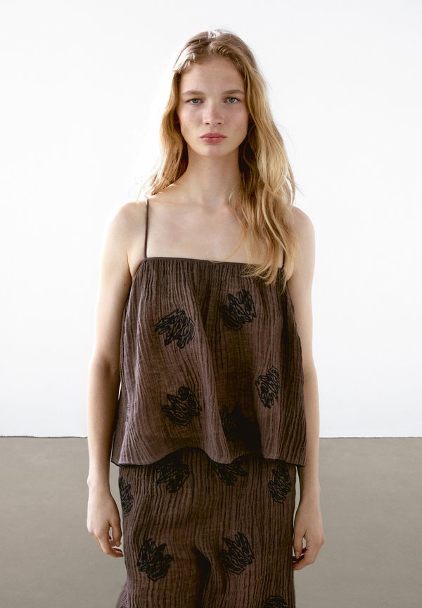 FLOWING TEXTURED WITH EMBROIDERED DETAIL 
 - Top