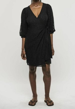 Black lace wrap dress with a deep V-neck, puffed sleeves, and a tie detail at the waist. Lightweight, textured fabric with a subtle pattern.