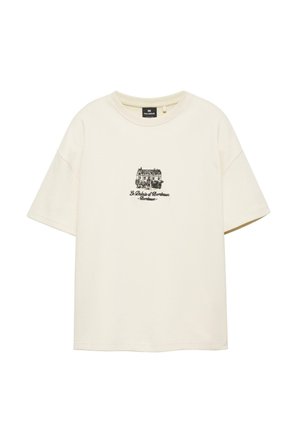 Crèmekleurig T-shirt met korte mouwen en ronde hals, met een kleine zwarte schets van een gebouw en de tekst "Le Palais d' Bordeaux - Bordeaux" gecentreerd op de voorkant.