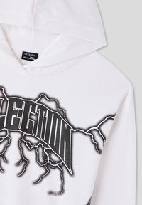 Felpa bianca con un design grafico nero caratterizzato da un motivo a fulmine e lettering audace. Realizzata in tessuto morbido, con cappuccio regolabile tramite cordoncino.