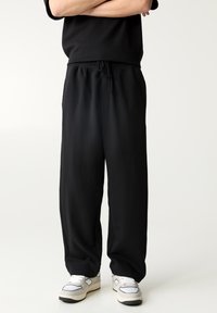 PULL&BEAR - INTERLOCK - Verryttelyhousut - black Pienoiskuva 1