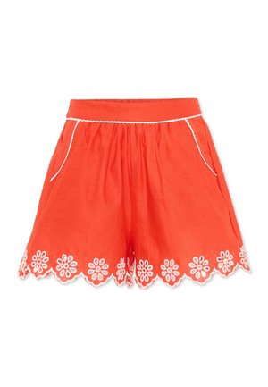 Pantaloncini arancioni brillanti con ricamo floreale bianco lungo l'orlo smerlato e dettagli in piping bianco vicino alle tasche.