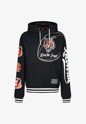 Hoodie noir avec une poche kangourou à l'avant, ornée d'un graphique de tigre et du texte « Règle la jungle ». Manches à rayures et détails du logo NFL.