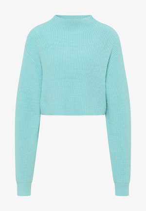 Skrajšan pulover v svetlo modri barvi. Ima rebrasto teksturo, dolge rokave in visok ovratnik. Narejen je iz mehkega, pletenega blaga.