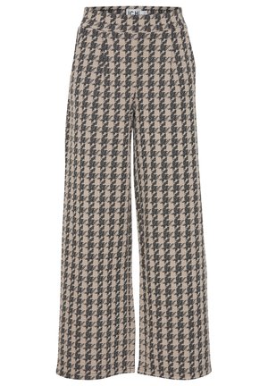Beige ja musta houndstooth mustriga laiad püksid, valmistatud tekstuurilisest kangast. Omab mugavat elastset vööd.