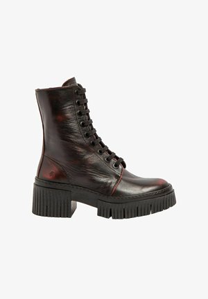 Black leather lace-up ankle boot with chunky ridged sole and block heel, featuring subtle red stitching and a zipper at the back.