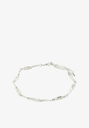 Pulsera de plata con un diseño irregular y ondulado, compuesta por eslabones alargados e interconectados y un cierre de gancho. Etiqueta de marca notable adjunta.
